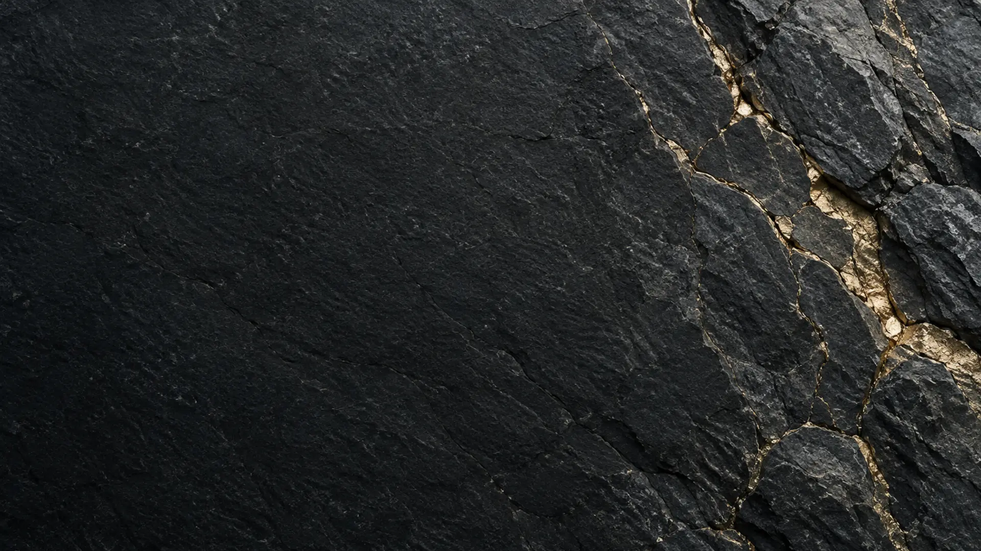 Dark stone joined by fine metallic seams